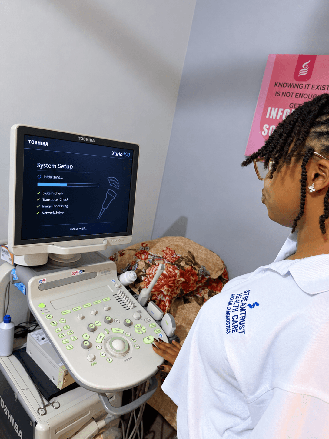 Sonographer preparing an ultrasound machine at StreamTrust Diagnostics